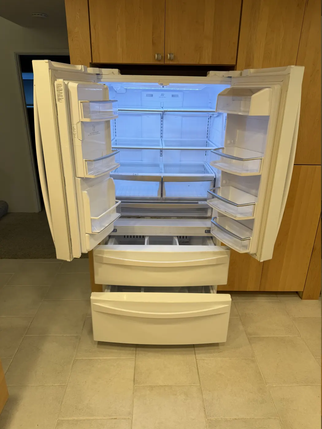 Open French-door refrigerator photographed before locating the source of an unusual sound