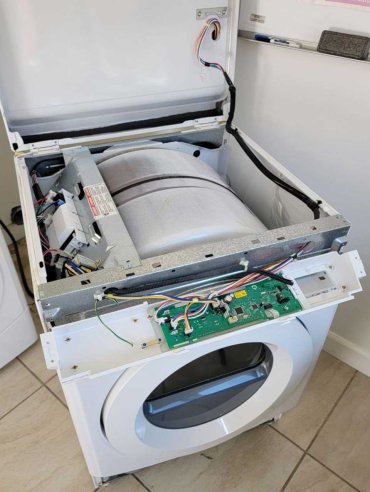 Dryer opened for control board diagnosis and repair